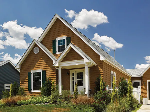 Home with brown shake and shingle siding